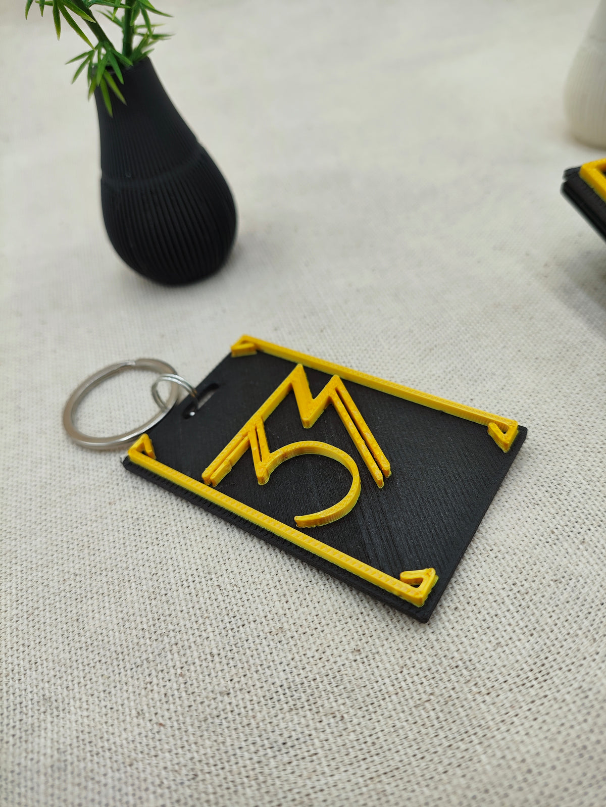 Llavero 3D - Brazalete 33
